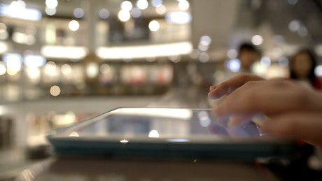 Using a tablet in a Mall.