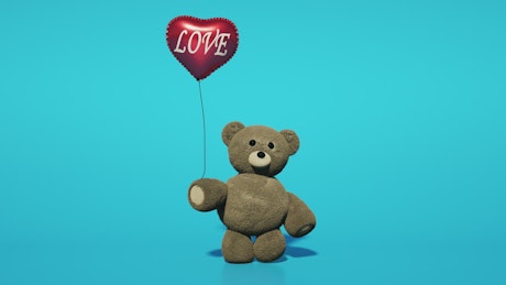 Valentine's Day love balloon being held by a plush teddy bear.