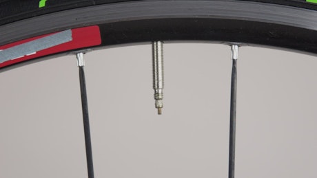 Valve cap on a bicycle wheel