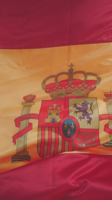 Vertical image of the Spanish flag waving