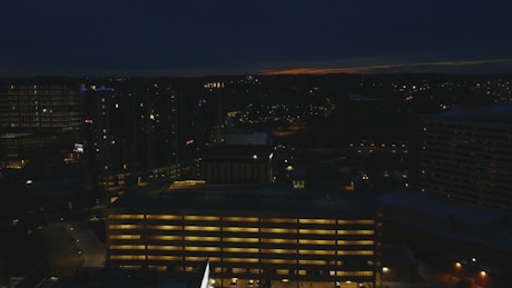 View from above to some buildings at night.