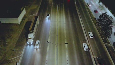 View from the top of a large highway at night.