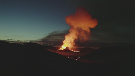 View of steam and lava from a volcano.