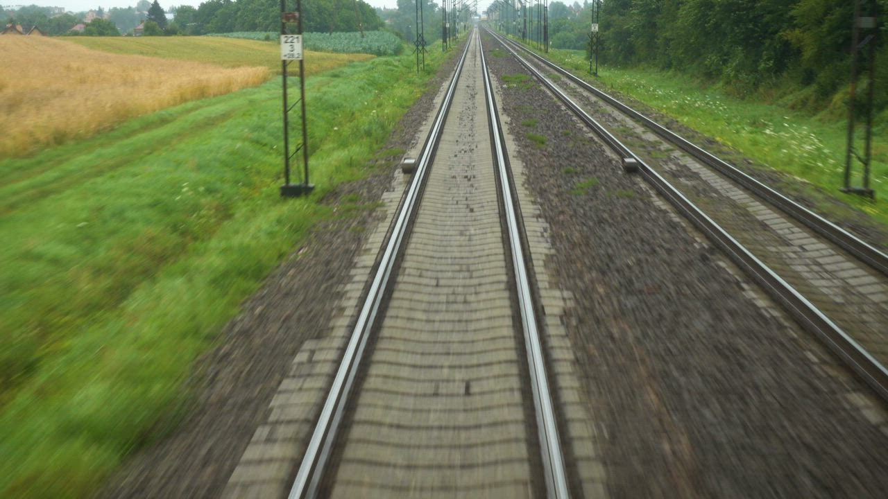 View of LIVE DRAW   the rail tracks from the train