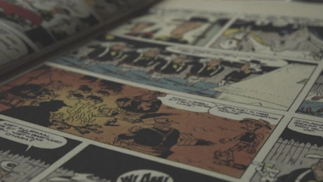 Vintage comic book open in a table.