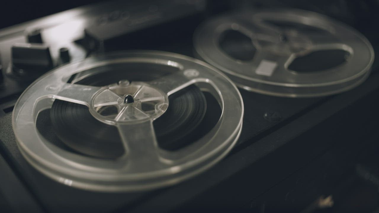 Vintage reel film tape rotating - Free Stock Video