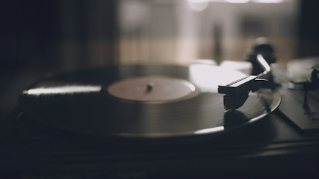 Vinyl record playing a song.