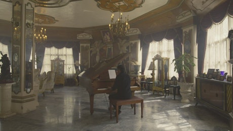 Virtuous pianist playing an elegant grand piano