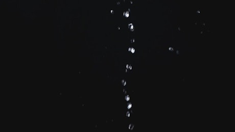 Water droplets falling down.