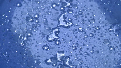 Water drops on clear plastic.