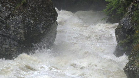Water flowing and crashing down the river