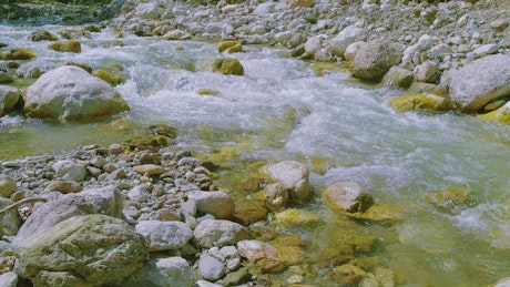 Water running down rocks in a river.