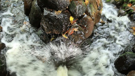 Water rushing between stones