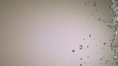 Water splash in slow motion on a white background
