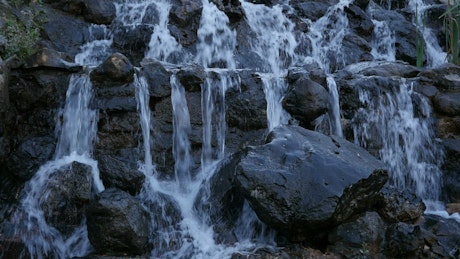 Waterfall on black rocks