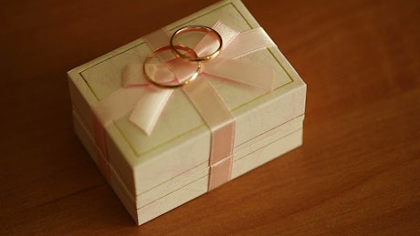 Wedding rings on its box.