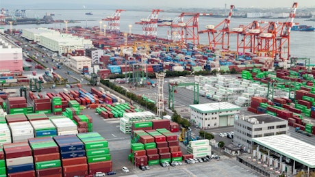 Wide container area on a cargo ship shoreline.