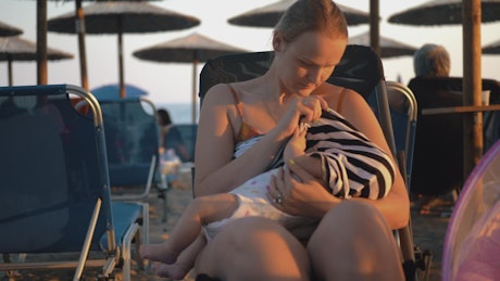 Woman breastfeeding her young baby.