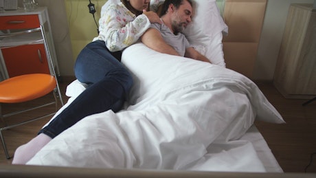 Woman comforting her husband
