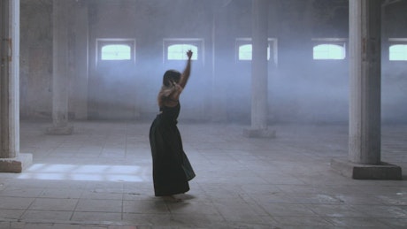 Woman dancing in an old abandoned place