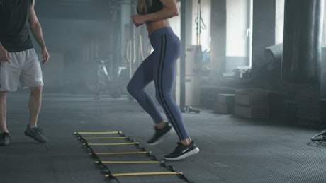 Woman doing aerobics on the gym.