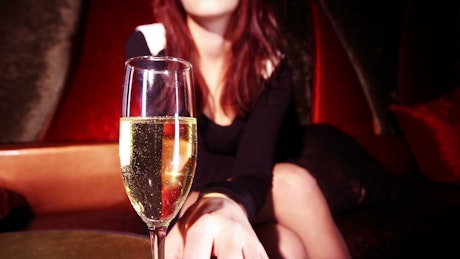 Woman drinking champagne.