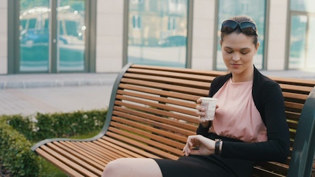 Woman drinking coffee on a break.