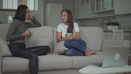 Woman having a conversation in the couch.