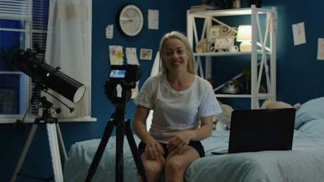 Woman making video her bedroom for social media