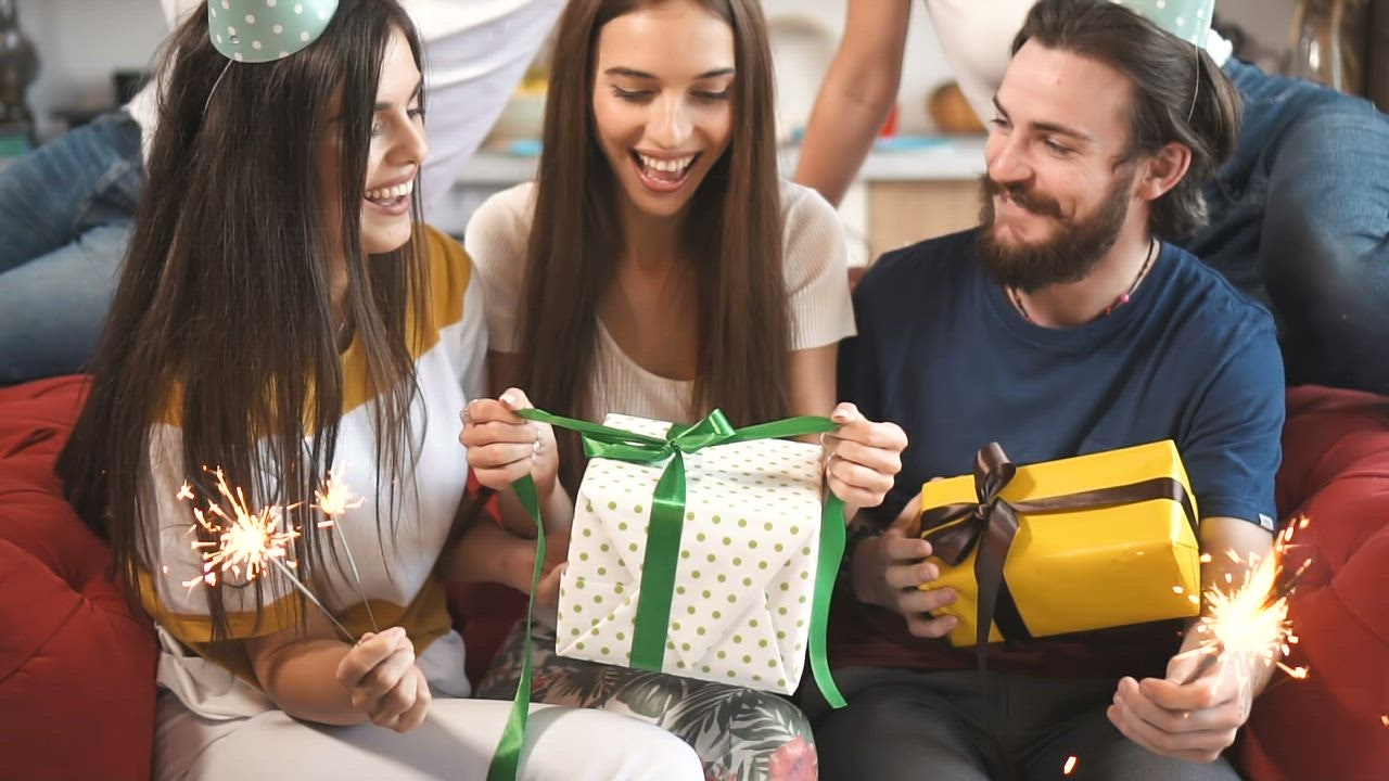 Woman Opening Her Birthday Presents Free Stock Video