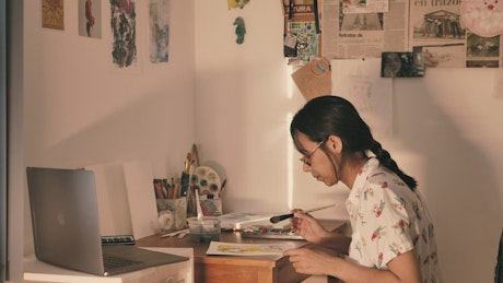 Woman painting in her studio