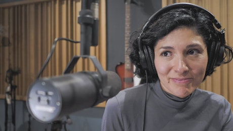Woman recording a podcast.