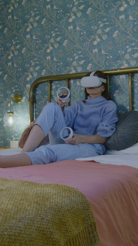 Woman resting while using virtual reality glasses.