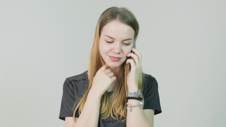 Woman smiling while chatting on her cell