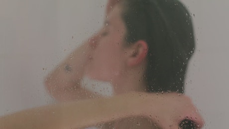 Woman taking a relaxing shower
