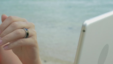 Woman using a bluetooth ring.