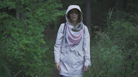 Woman walking in the woods.