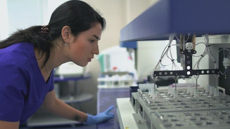 Woman working with samples in laboratory.