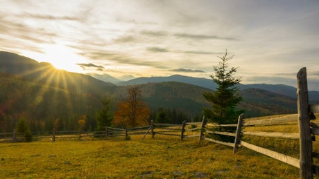 Wooden fence and the mountains