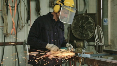 Worker using a metal welder.