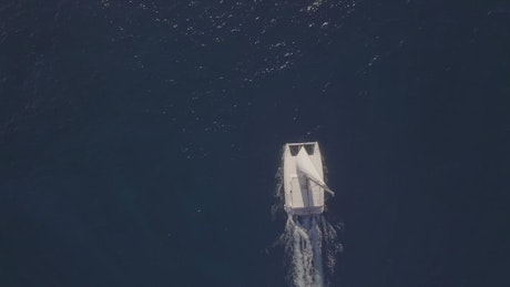 Yacht against a deep blue ocean.