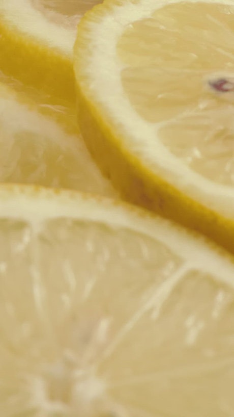 Yellow lemon slices in detail.