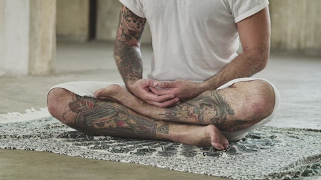 Yoga instructor aligning his chakras.
