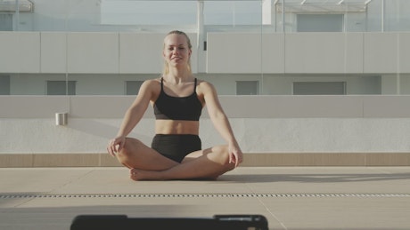 Yoga teacher in front camera.