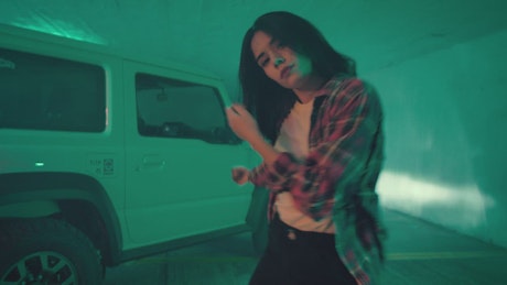 Young black haired girl dancing.