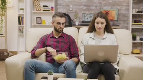 Young couple shopping online together