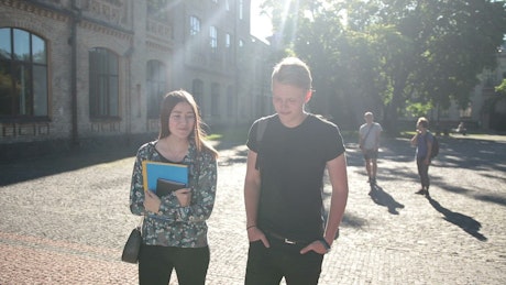 Young couple walking at College.