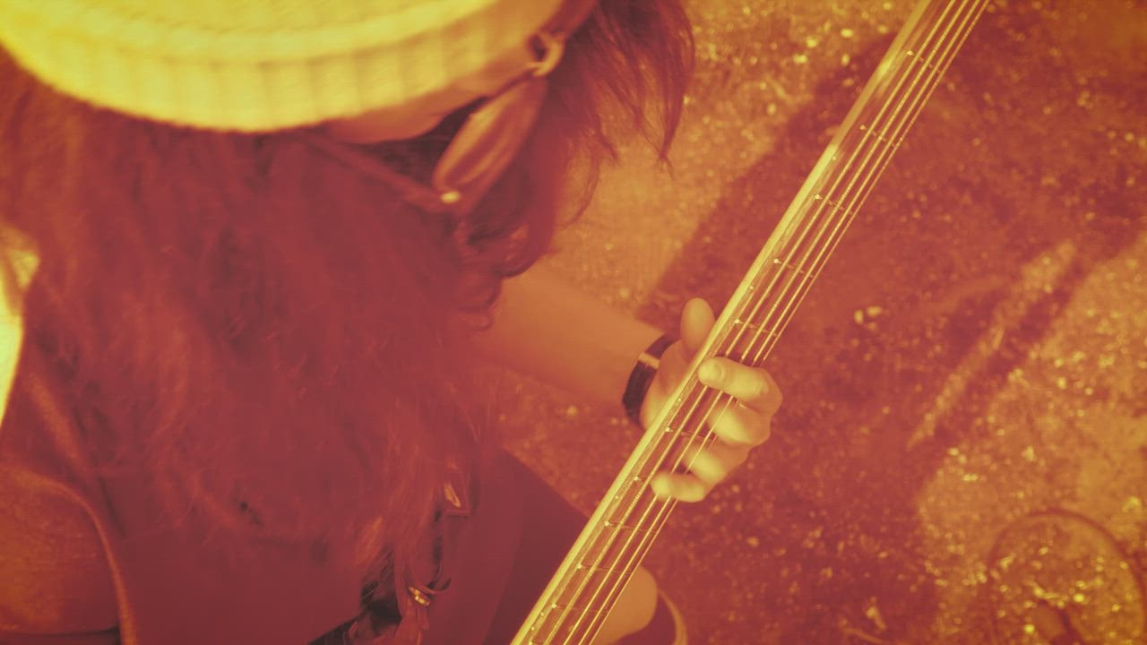 Young girl playing the bass, close up - Free Stock Video