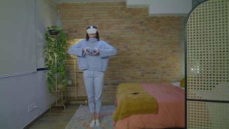 Young woman doing yoga with virtual reality.