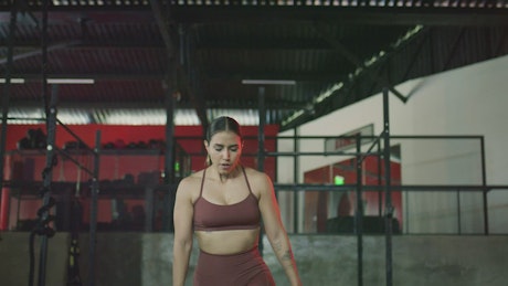 Young woman exercising in a gym.